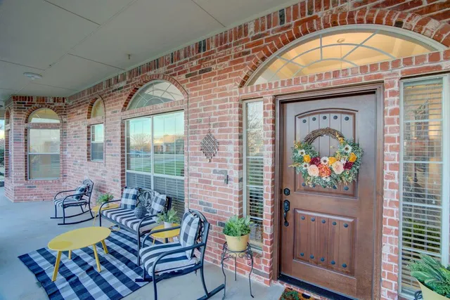 a living room with furniture a fireplace and a table