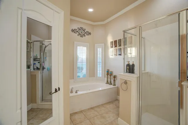 a bathroom with a bathtub and a shower
