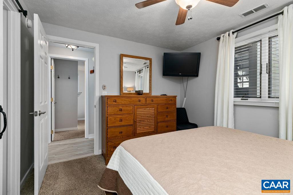 405 3 Ridges Roseland, VA 22967 - Photo 16 of 22 a bedroom with a bed and a flat screen tv