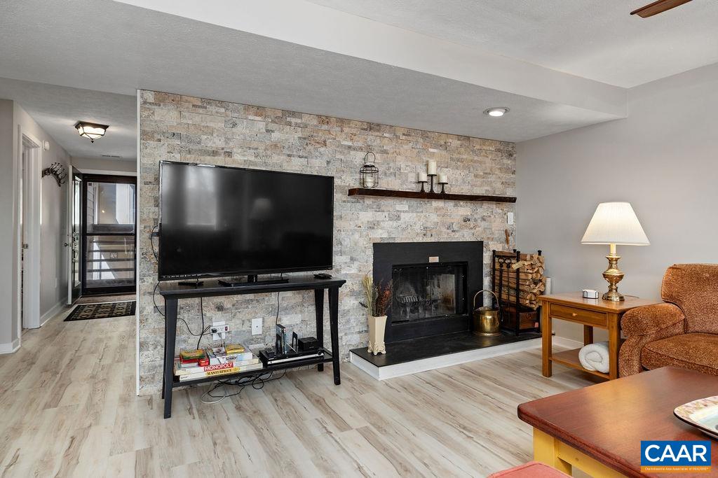405 3 Ridges Roseland, VA 22967 - Photo 2 of 22 a living room with furniture and a flat screen tv