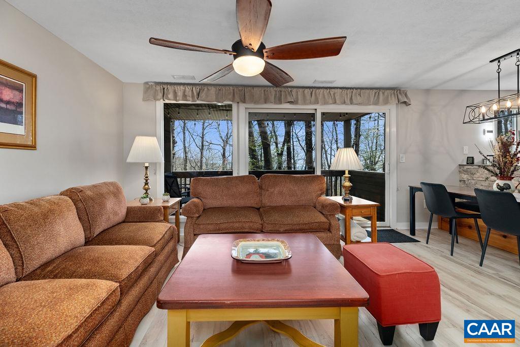 405 3 Ridges Roseland, VA 22967 - Photo 5 of 22 a living room with furniture a chandelier and a dining table