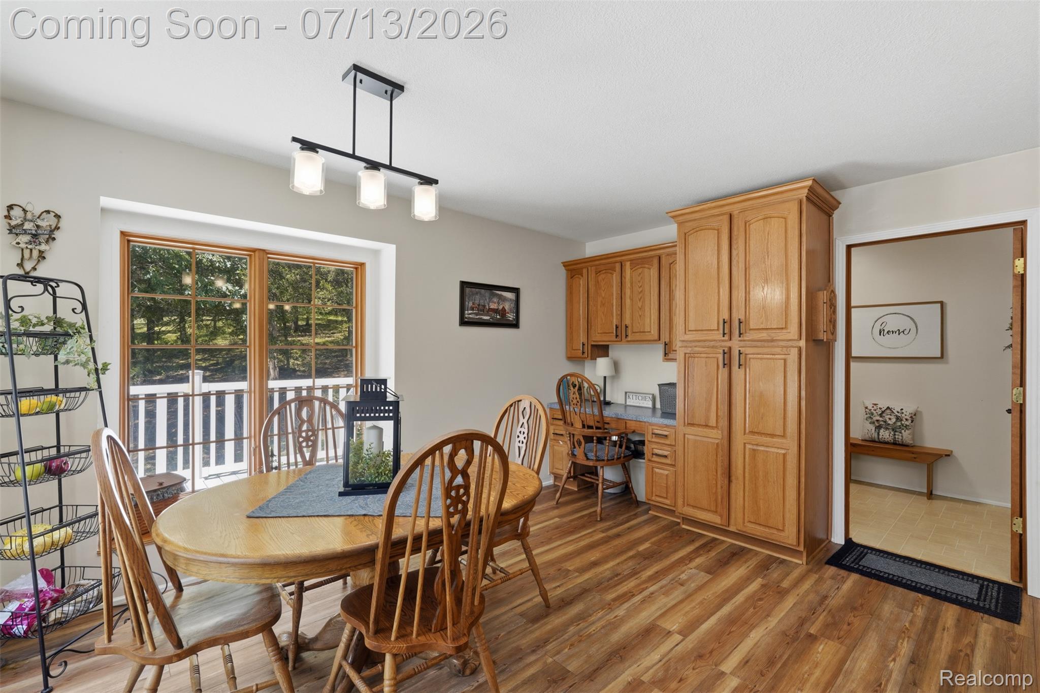 10525 Antcliff Road Brooklyn, MI 49230 - Photo 16 of 80 Kitchen featuring new laminate flooring and panoramic views from the wraparound porch
