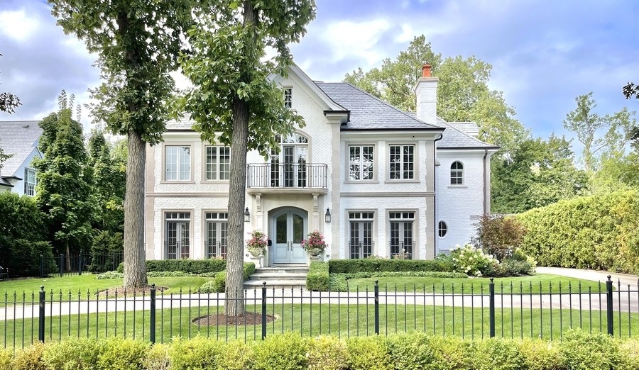 1045 Starr Road Winnetka, IL 60093 - Photo 1 of 57 a front view of a house with a garden