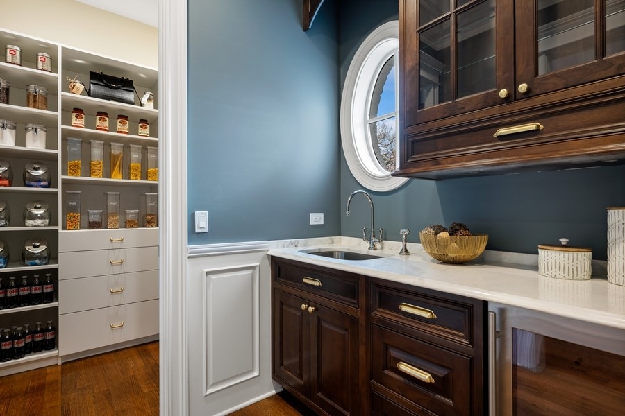 1045 Starr Road Winnetka, IL 60093 - Photo 14 of 57 a bathroom with a sink and a mirror
