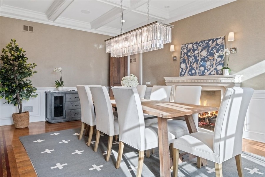 1045 Starr Road Winnetka, IL 60093 - Photo 16 of 57 a view of a dining room with furniture and chandelier