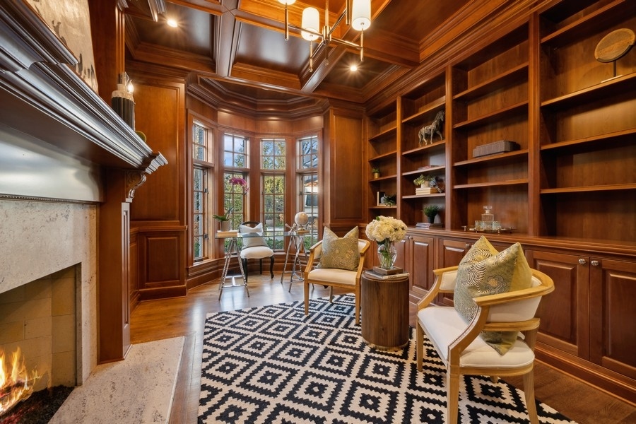 1045 Starr Road Winnetka, IL 60093 - Photo 17 of 57 a living room with furniture a rug and a fireplace
