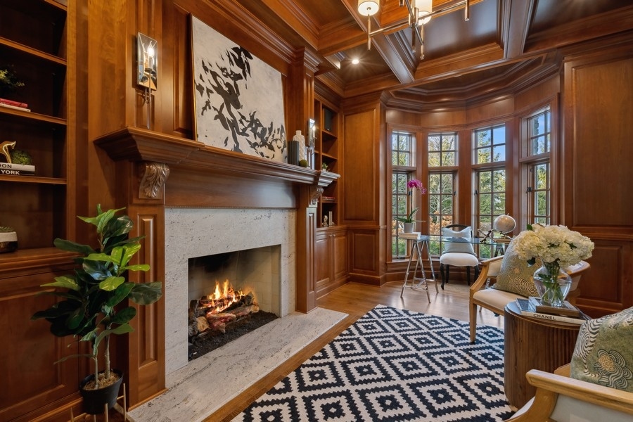1045 Starr Road Winnetka, IL 60093 - Photo 18 of 57 a living room with furniture and a fireplace