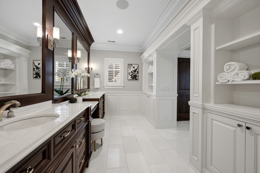 1045 Starr Road Winnetka, IL 60093 - Photo 24 of 57 a bathroom with a sink double vanity and a mirror