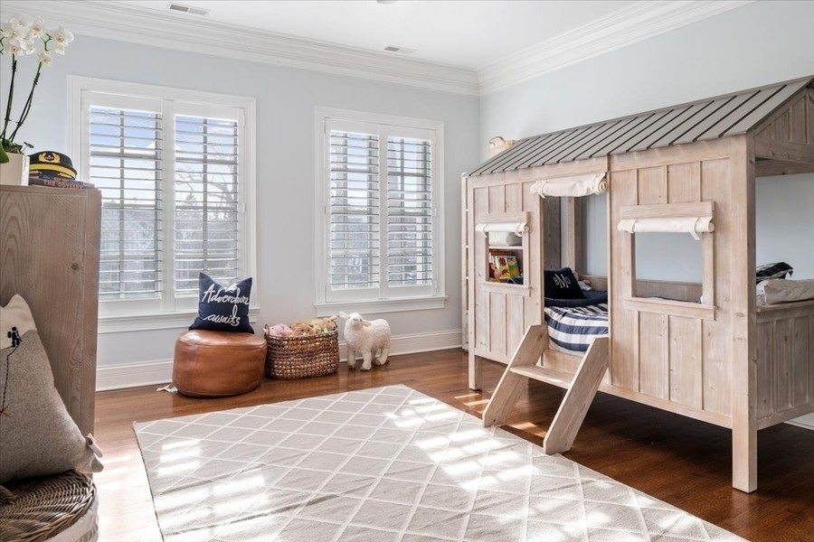 1045 Starr Road Winnetka, IL 60093 - Photo 28 of 57 a bedroom with furniture and a window