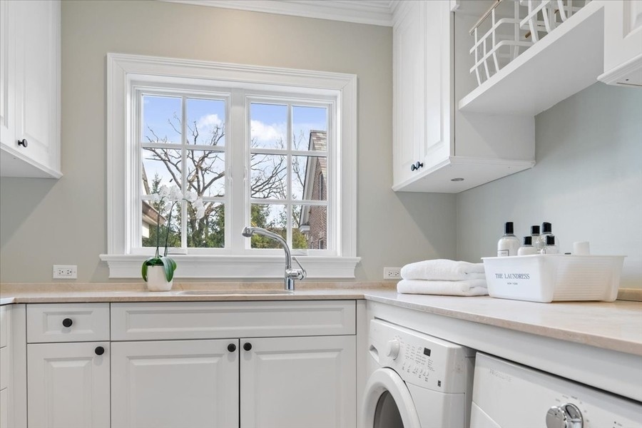 1045 Starr Road Winnetka, IL 60093 - Photo 34 of 57 a view of cabinets a sink and a window