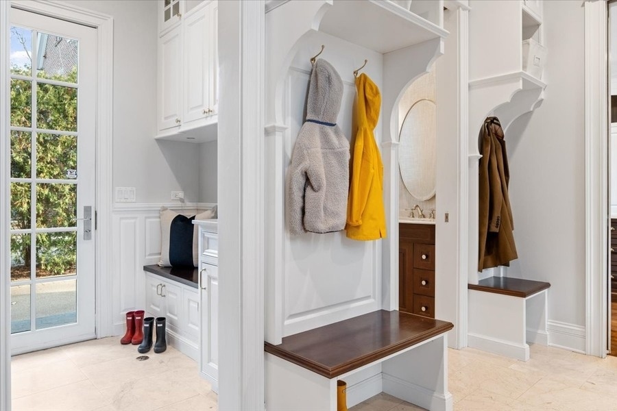 1045 Starr Road Winnetka, IL 60093 - Photo 38 of 57 a view of walk in closet with clothes and shoes