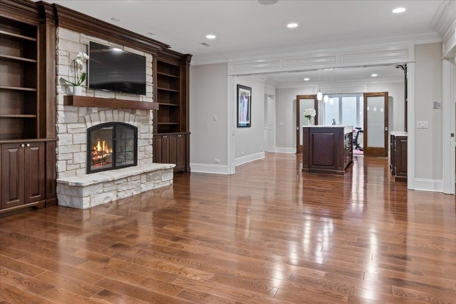 1045 Starr Road Winnetka, IL 60093 - Photo 43 of 57 a living room with furniture and a fireplace