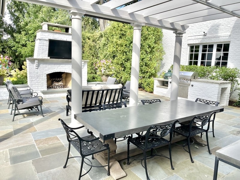1045 Starr Road Winnetka, IL 60093 - Photo 50 of 57 a view of a patio with a dining table and chairs