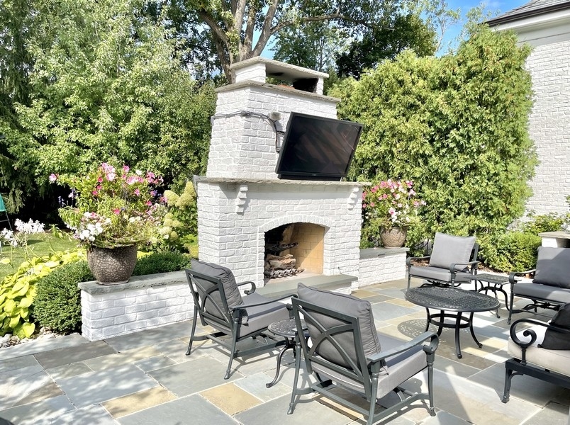 1045 Starr Road Winnetka, IL 60093 - Photo 51 of 57 a view of a patio with table and chairs and potted plants