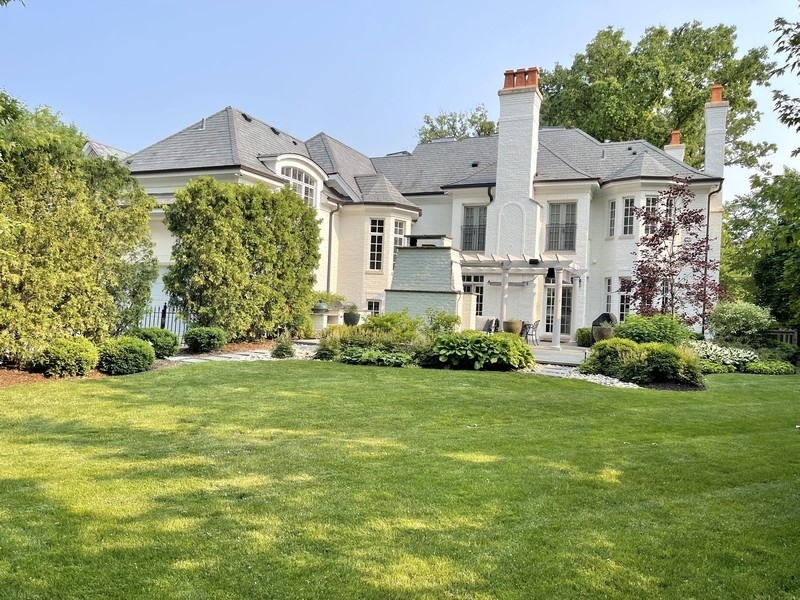 1045 Starr Road Winnetka, IL 60093 - Photo 53 of 57 a front view of a house with a yard and garage