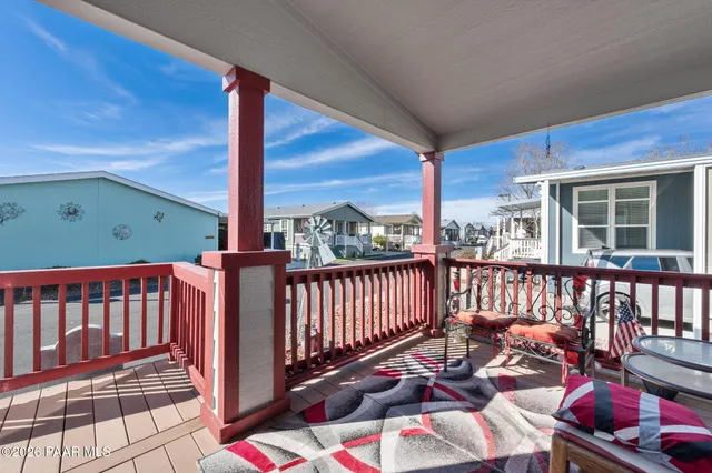a view of a two chairs on the deck