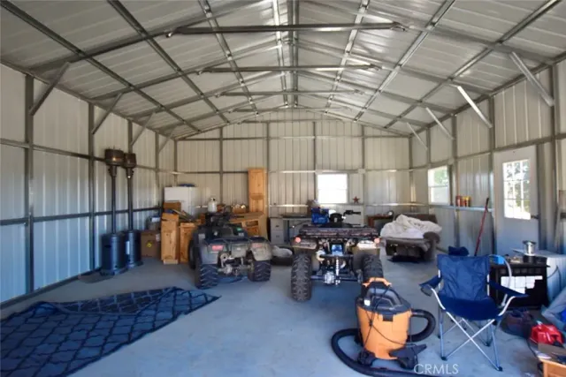 a living room with lots of furniture and a chandelier