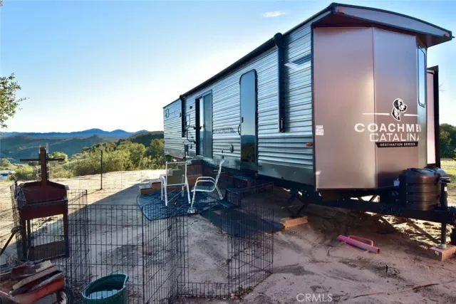 a backyard of a house with outdoor seating
