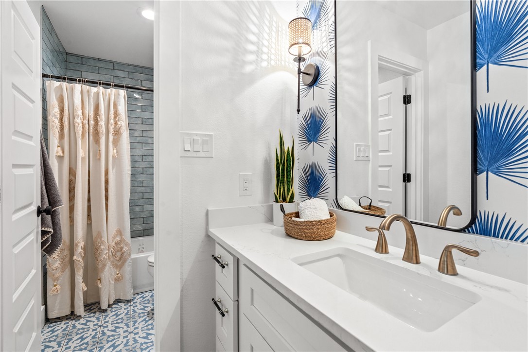 3808 Leafield Drive Austin, TX 78749 - Photo 17 of 31 a bathroom with a sink and a mirror
