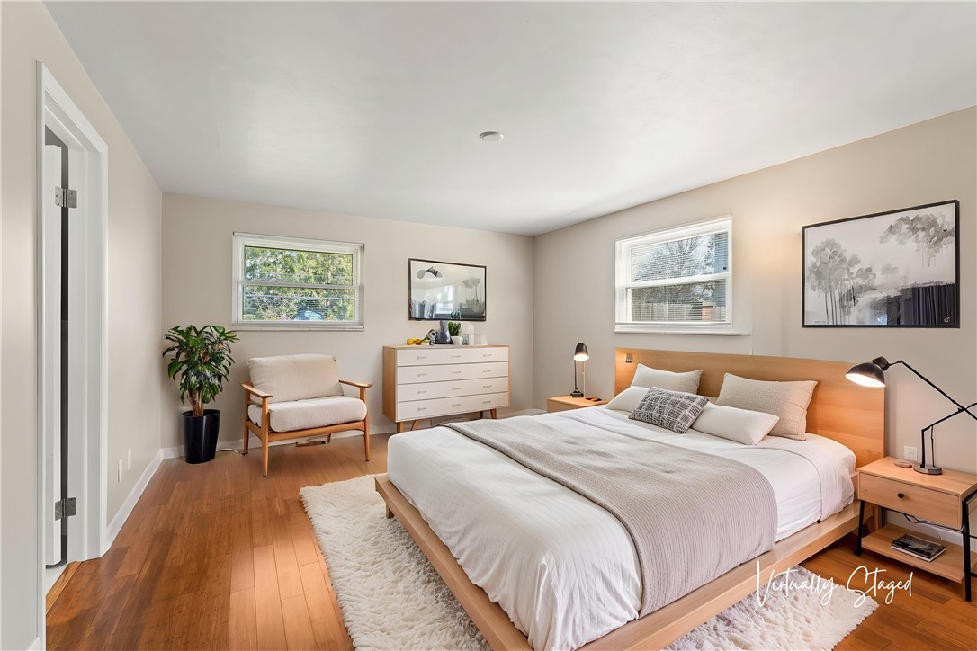 2247 East Whipp Road Dayton, OH 45440 - Photo 24 of 52 This serene bedroom offers ample natural light and beautiful wood flooring, creating a peaceful retreat.