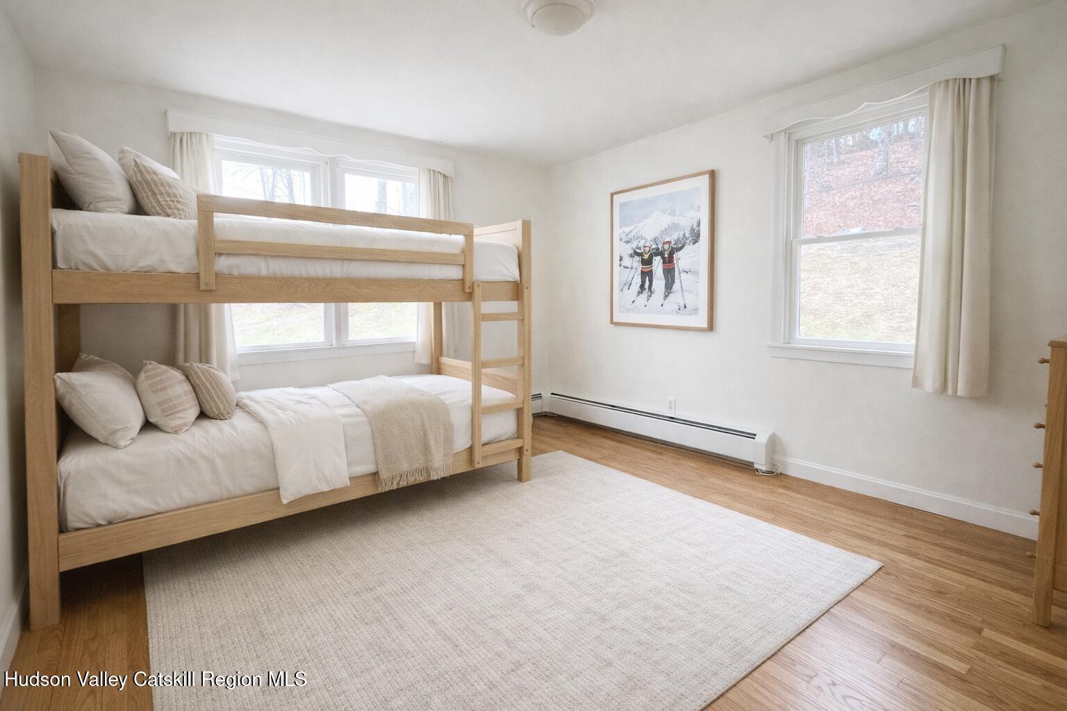 265 Scribner Hollow Road Hunter, NY 12442 - Photo 13 of 26 a bed room with a bed and a window