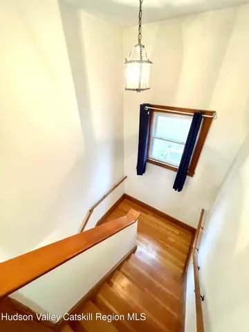 a bathroom with a sink toilet a mirror and bathtub