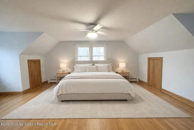 a bedroom with a bed and window