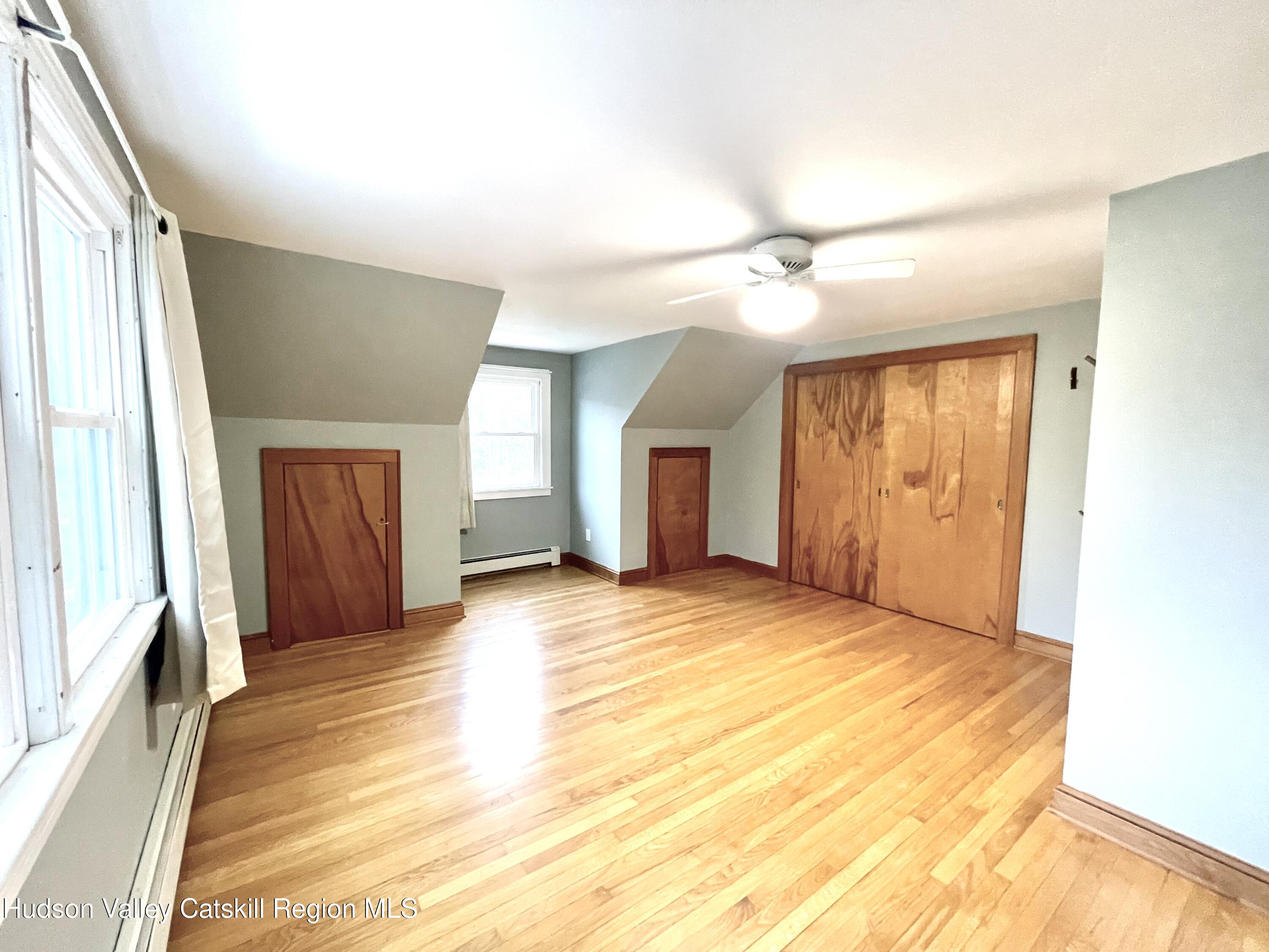 265 Scribner Hollow Road Hunter, NY 12442 - Photo 23 of 26 a view of an empty room with window and a kitchen