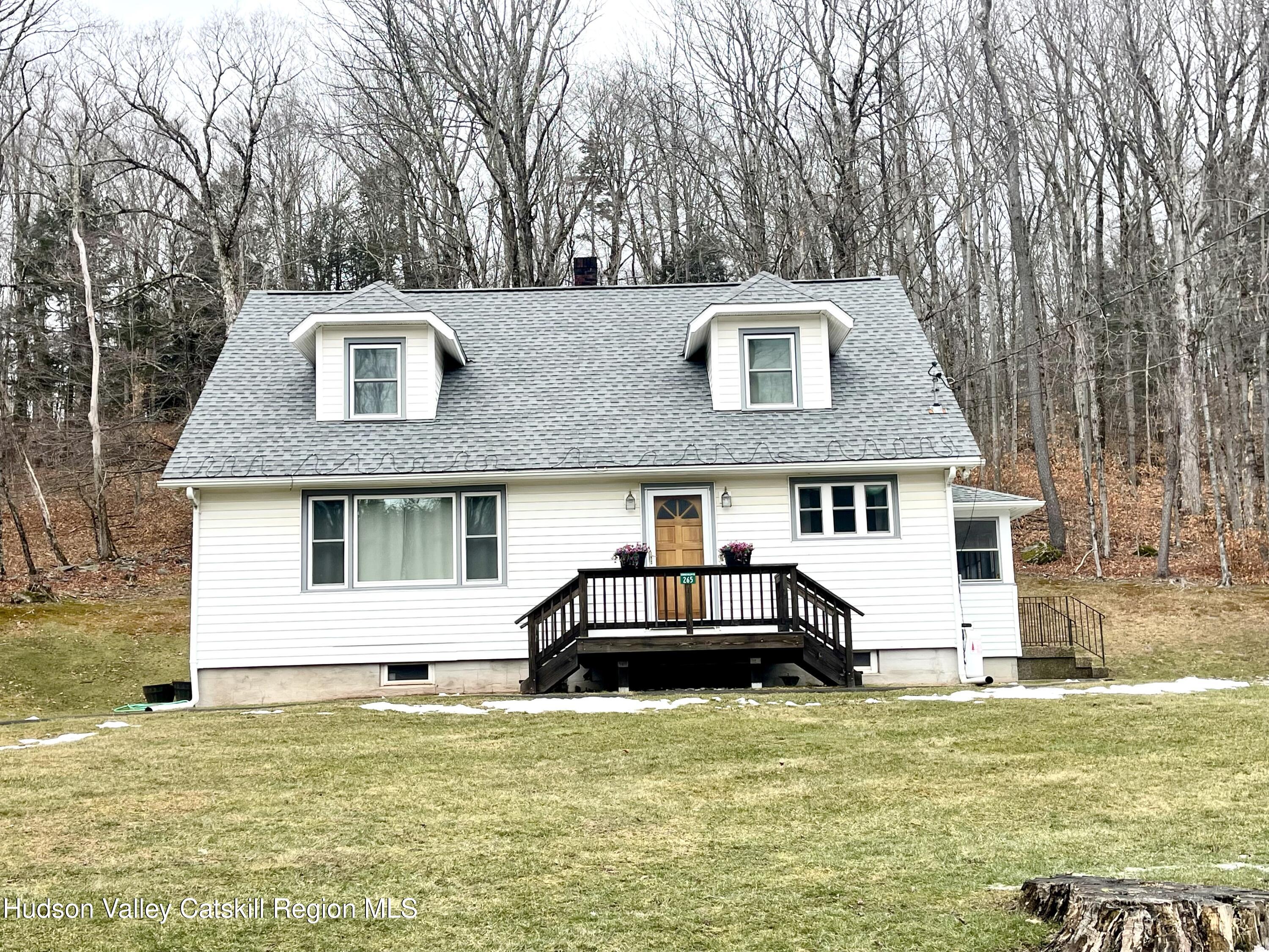 265 Scribner Hollow Road Hunter, NY 12442 - Photo 3 of 26 a front view of a house with a yard
