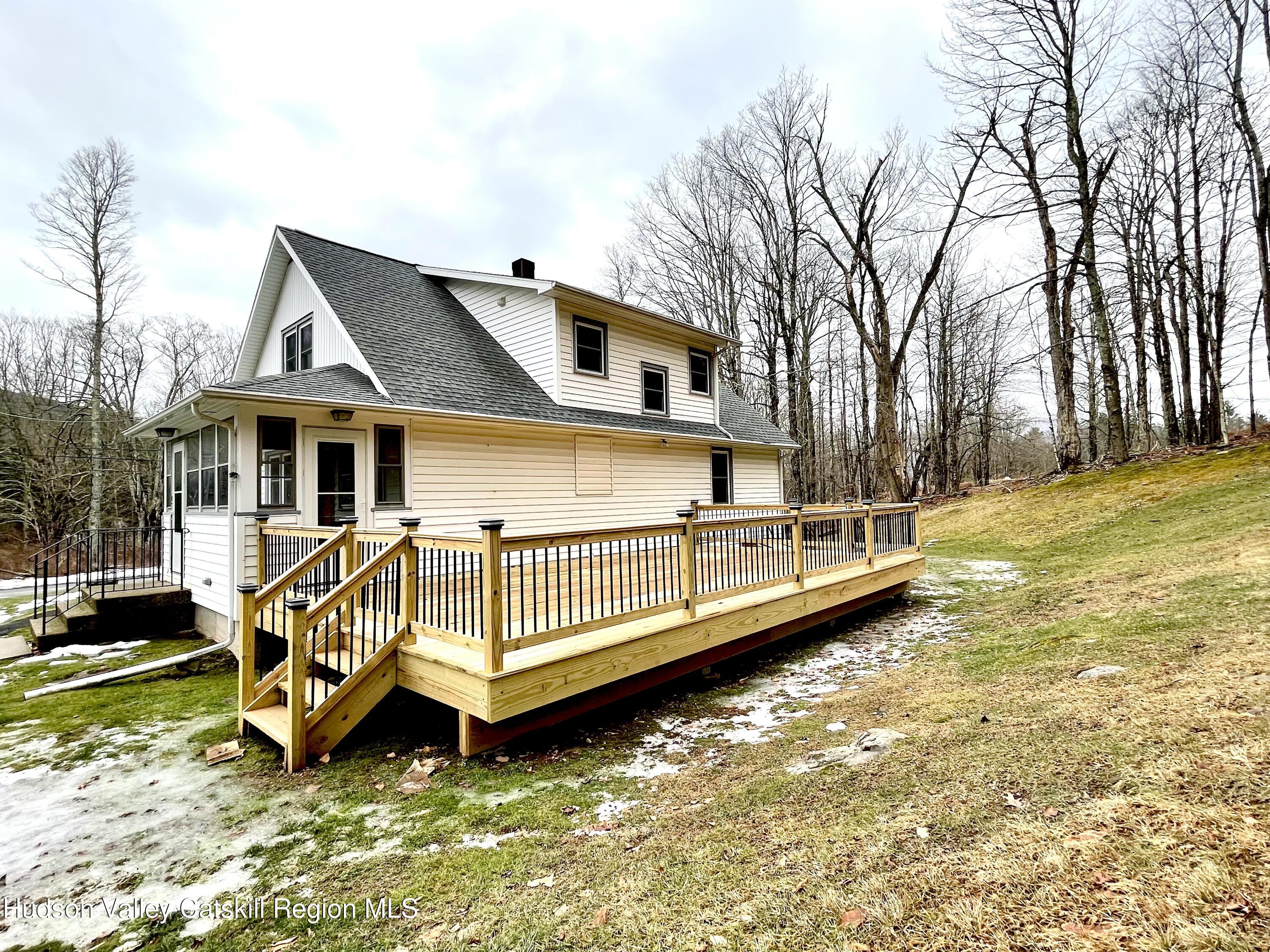 265 Scribner Hollow Road Hunter, NY 12442 - Photo 5 of 26 a view of a house with a yard