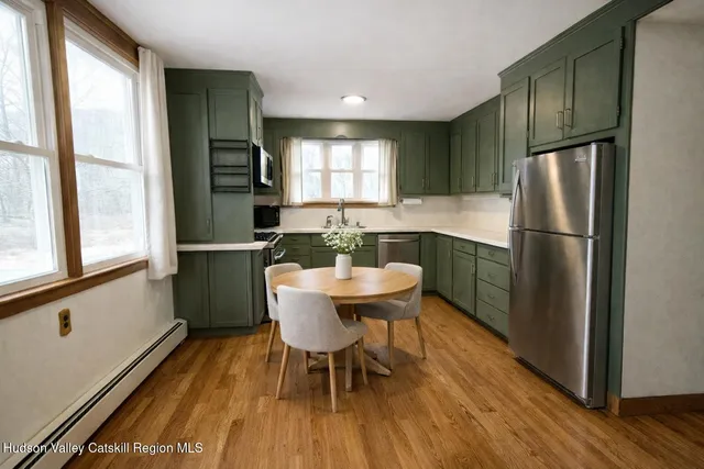 a kitchen with a sink a stove and cabinets