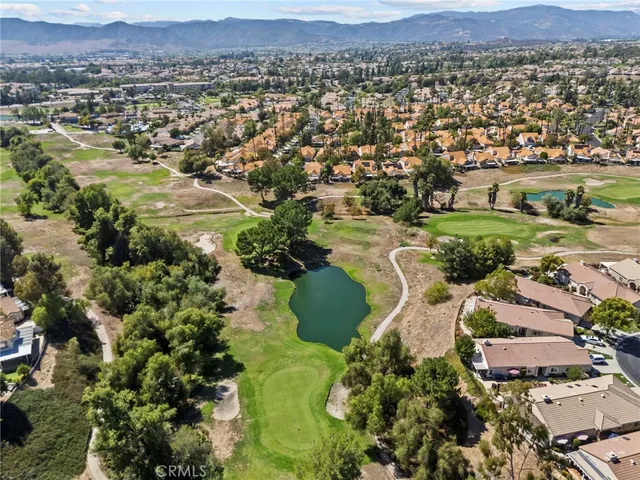 an aerial view of a residential houses with outdoor space
