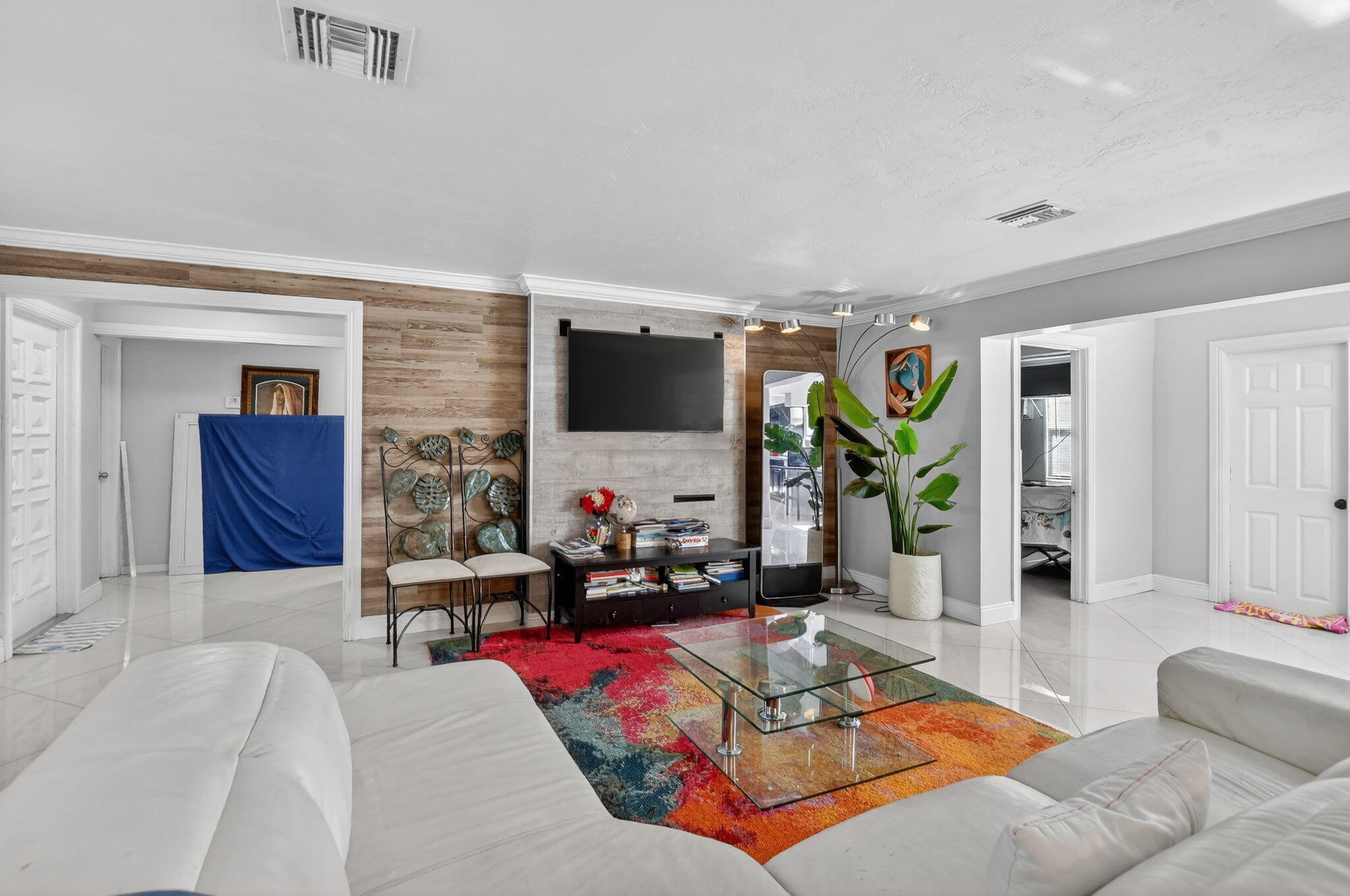 256 Southwest 11th Place Boca Raton, FL 33432 - Photo 11 of 43 a living room with furniture and a flat screen tv