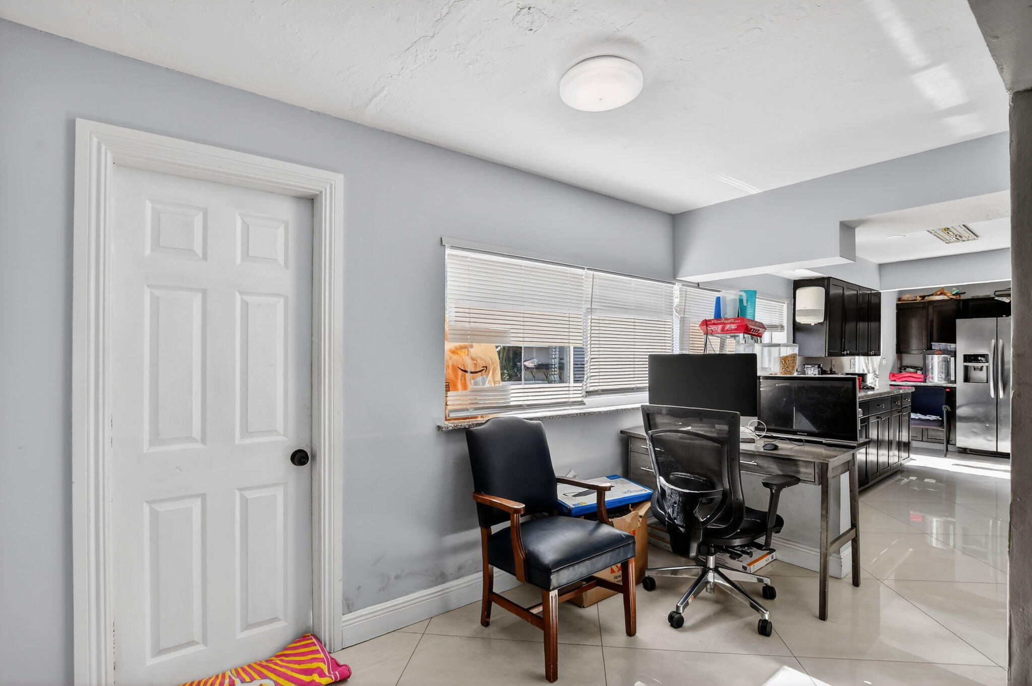 256 Southwest 11th Place Boca Raton, FL 33432 - Photo 15 of 43 a workspace with a desk and a chair