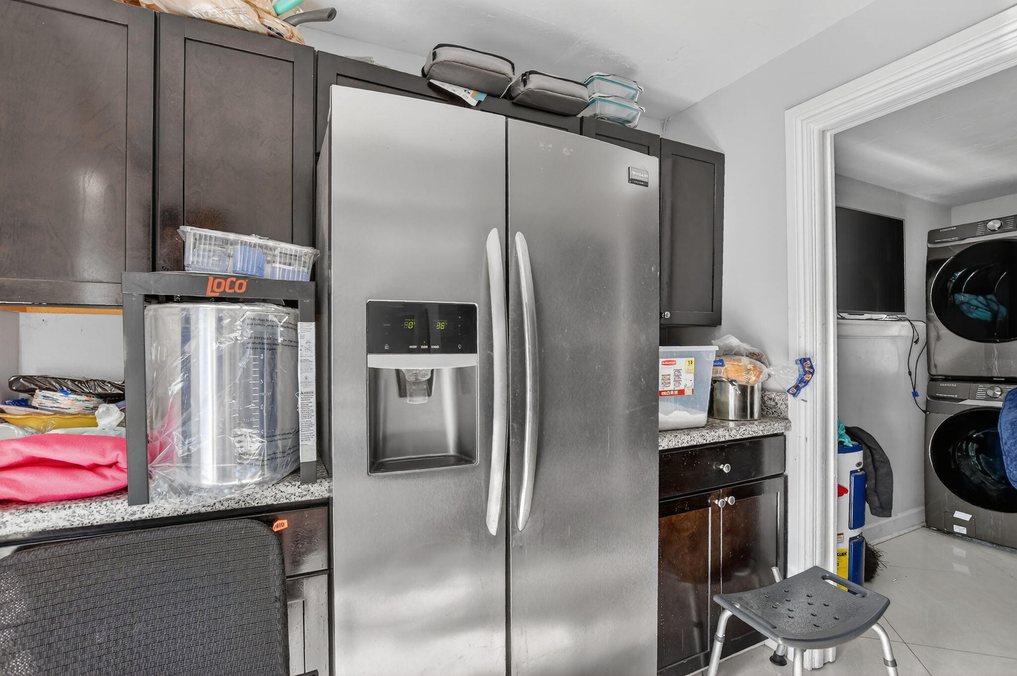 256 Southwest 11th Place Boca Raton, FL 33432 - Photo 21 of 43 a kitchen with a refrigerator and cabinets