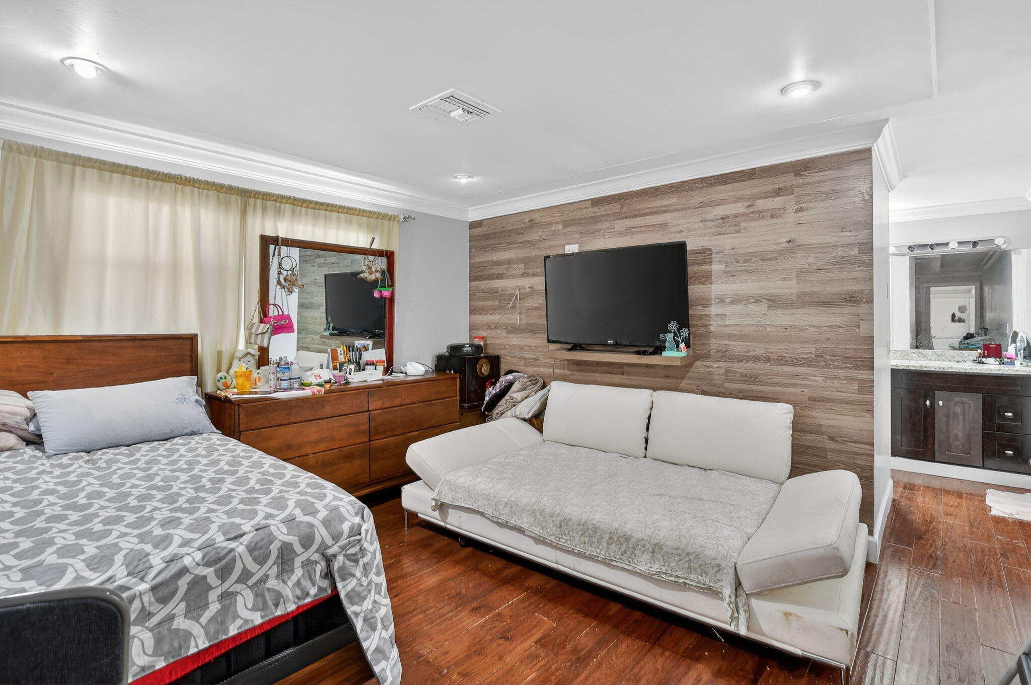 256 Southwest 11th Place Boca Raton, FL 33432 - Photo 27 of 43 a living room with furniture and a flat screen tv