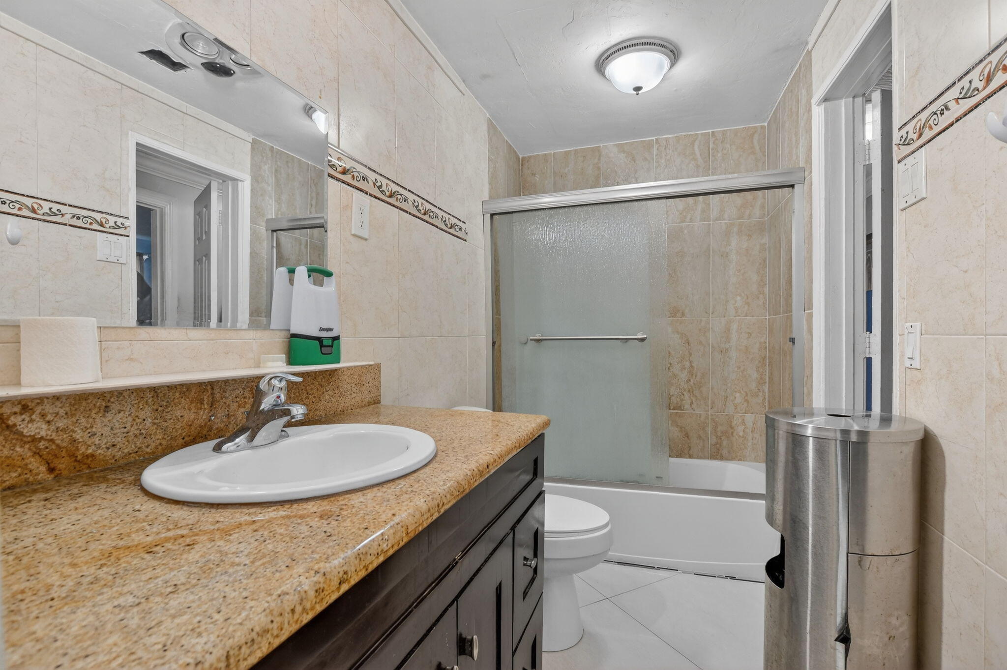 256 Southwest 11th Place Boca Raton, FL 33432 - Photo 33 of 43 a bathroom with a sink toilet a mirror and shower