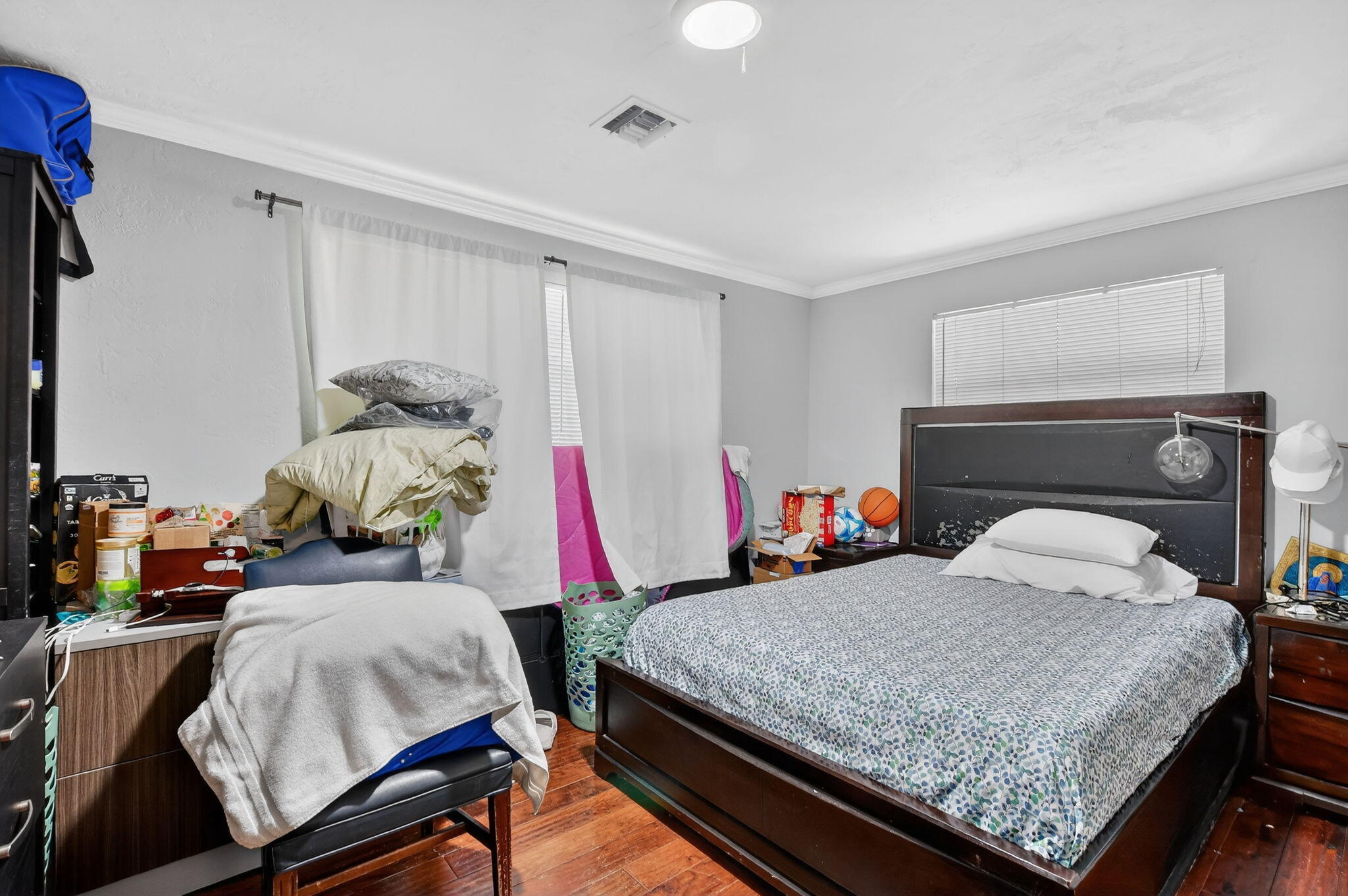 256 Southwest 11th Place Boca Raton, FL 33432 - Photo 34 of 43 a bedroom with bed and a window