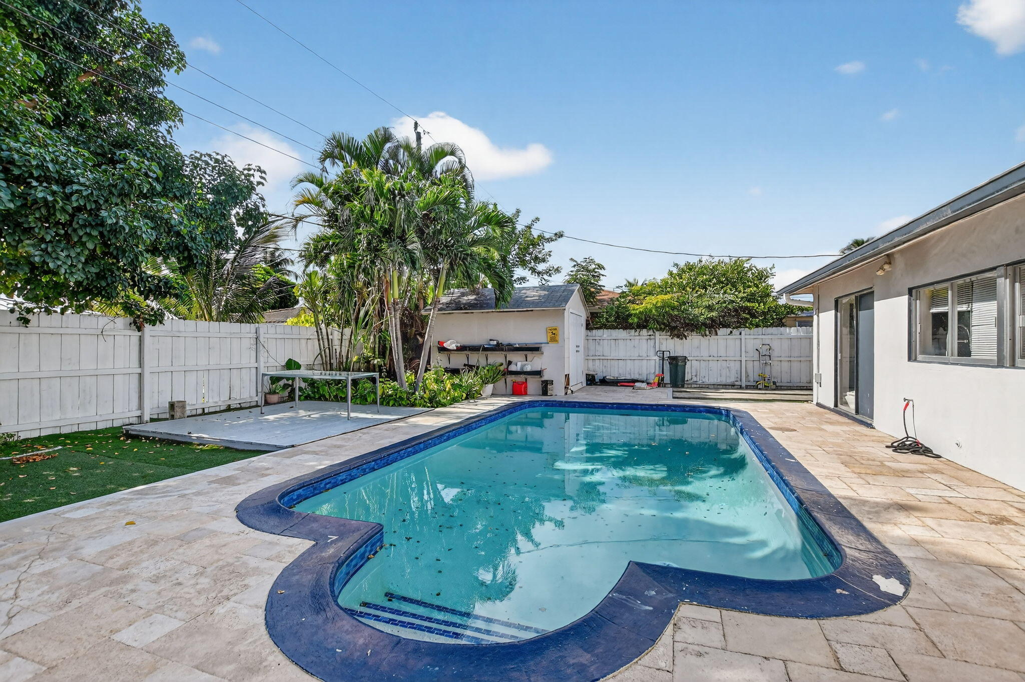 256 Southwest 11th Place Boca Raton, FL 33432 - Photo 36 of 43 a view of a house with swimming pool