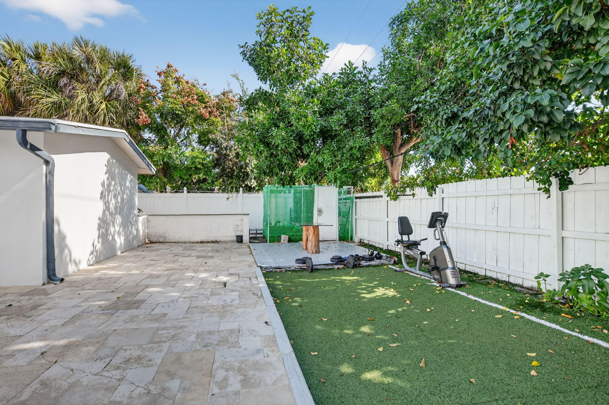256 Southwest 11th Place Boca Raton, FL 33432 - Photo 38 of 43 a view of backyard with a white house and a large tree