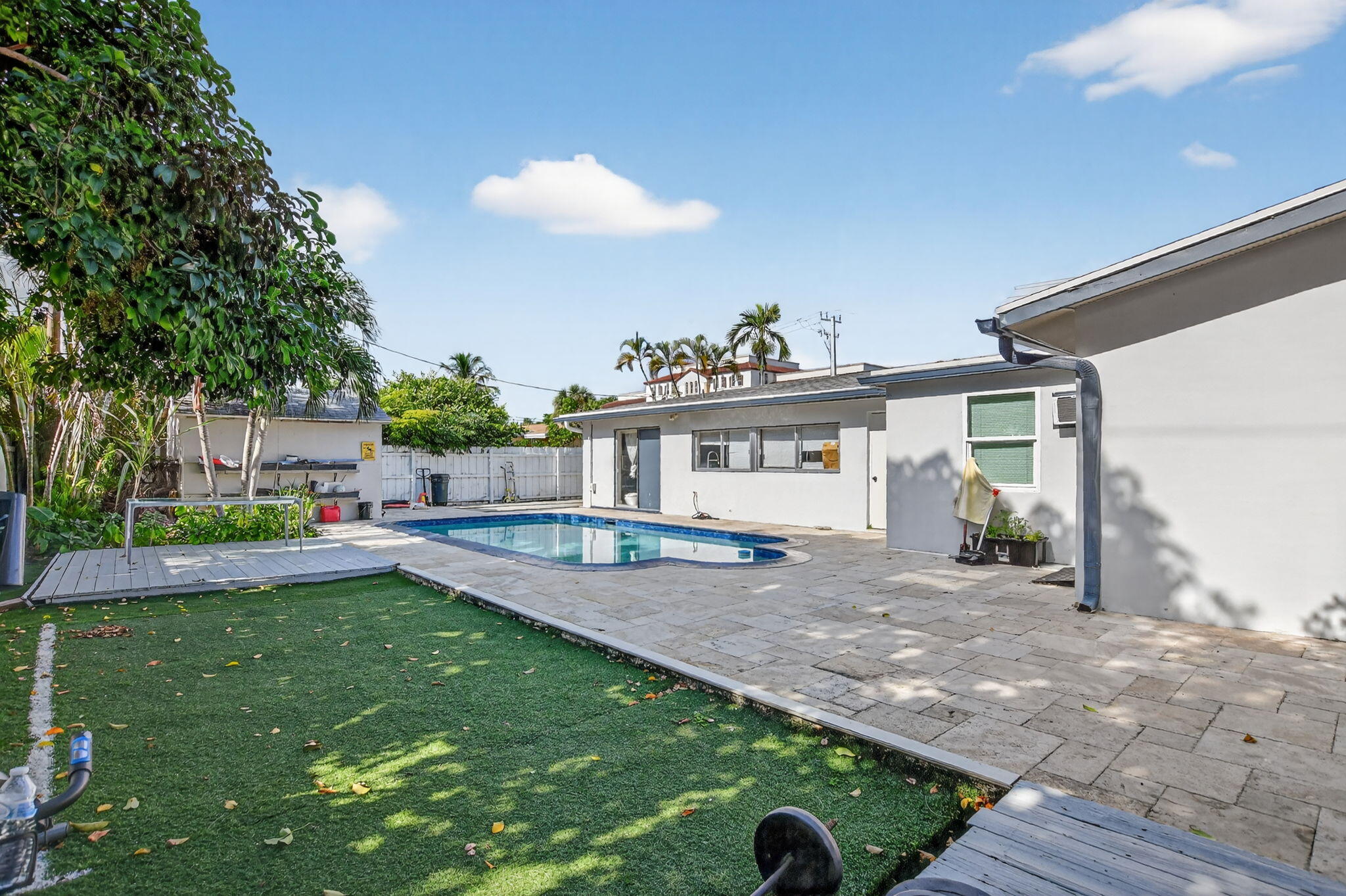 256 Southwest 11th Place Boca Raton, FL 33432 - Photo 39 of 43 a view of a house with backyard and sitting area