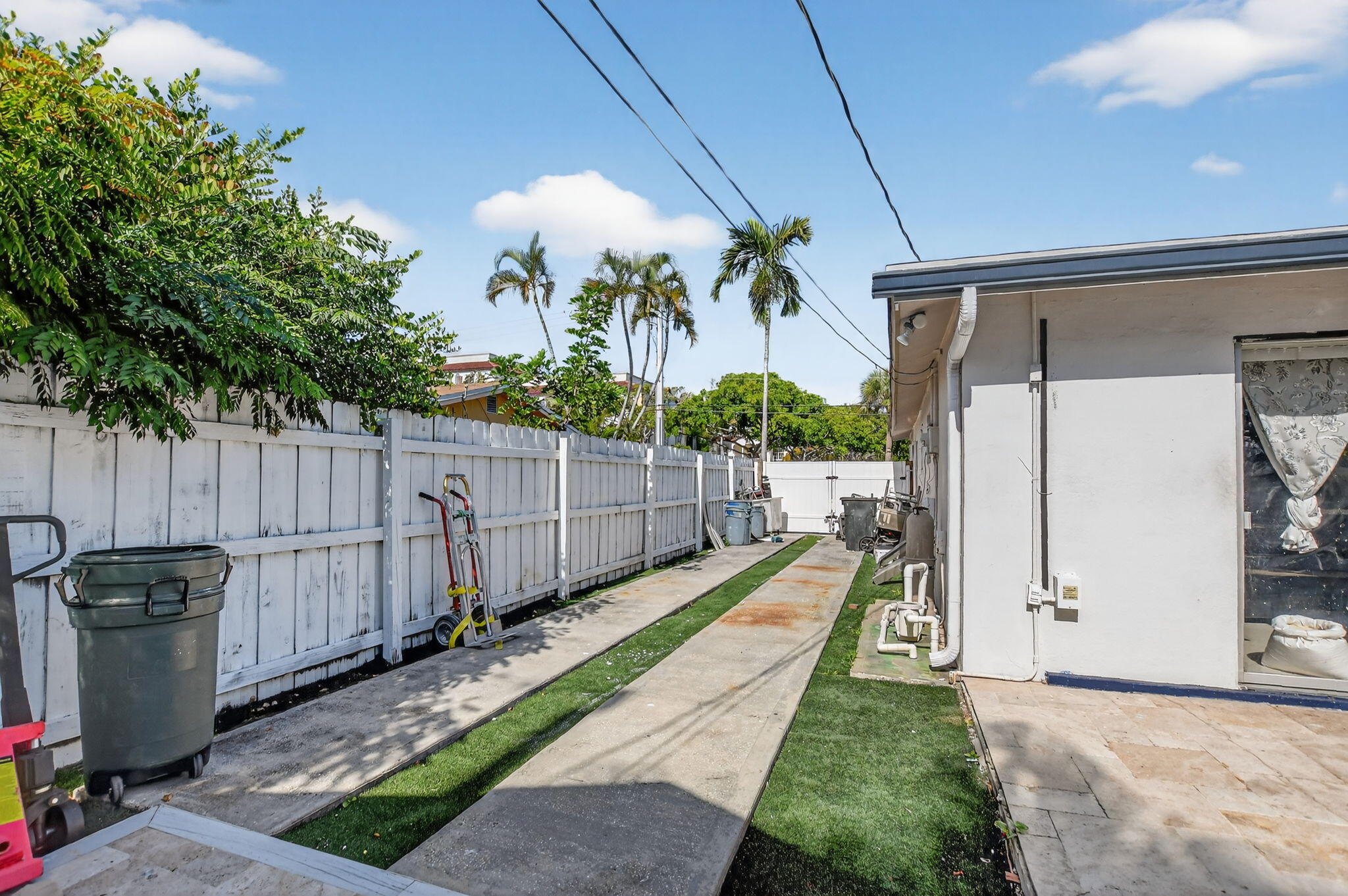 256 Southwest 11th Place Boca Raton, FL 33432 - Photo 43 of 43 a view of a backyard with wooden fence