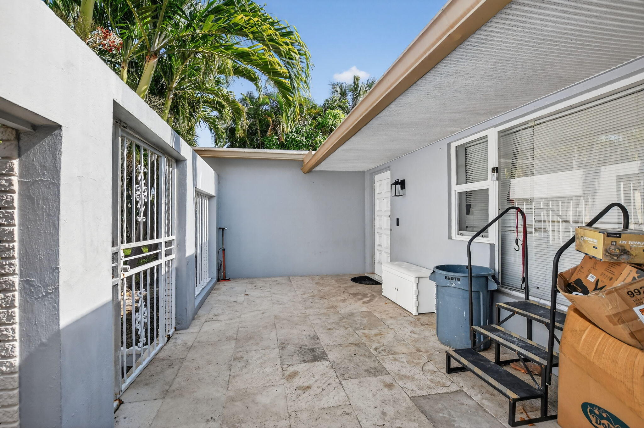 256 Southwest 11th Place Boca Raton, FL 33432 - Photo 6 of 43 a view of an entryway with a lot of trees