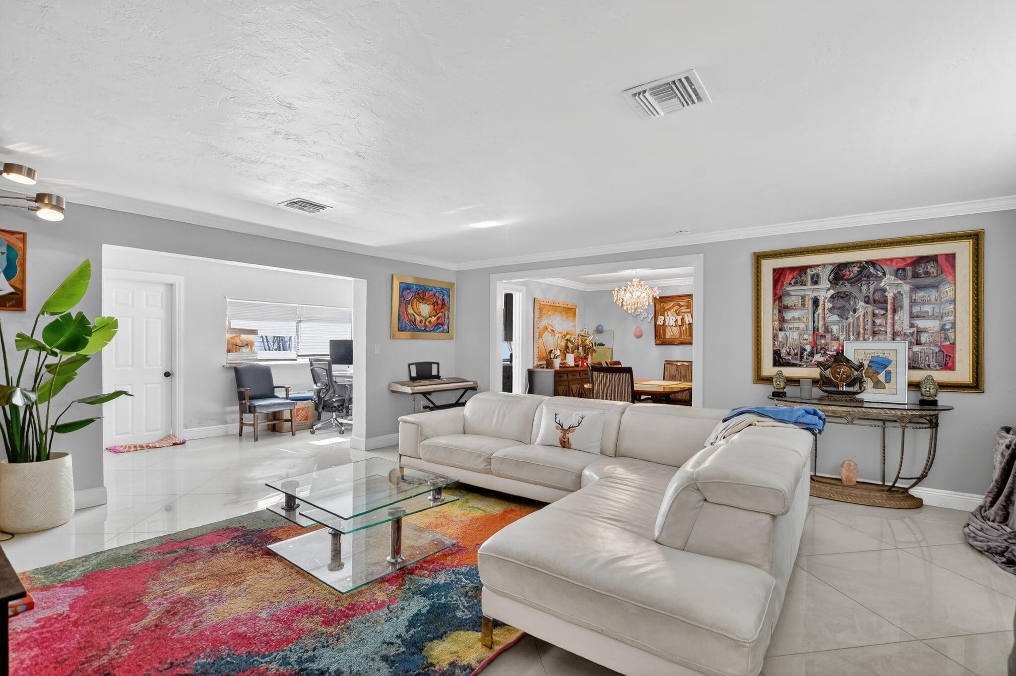 256 Southwest 11th Place Boca Raton, FL 33432 - Photo 8 of 43 a living room with furniture a rug and a large window