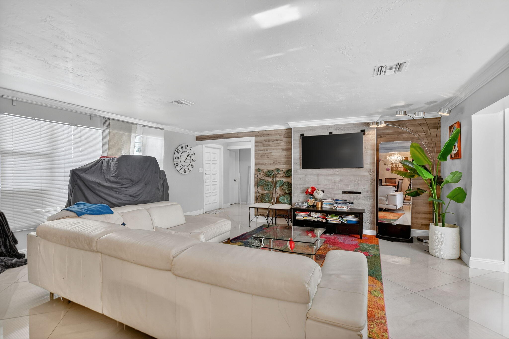 256 Southwest 11th Place Boca Raton, FL 33432 - Photo 10 of 43 a living room with furniture and a flat screen tv