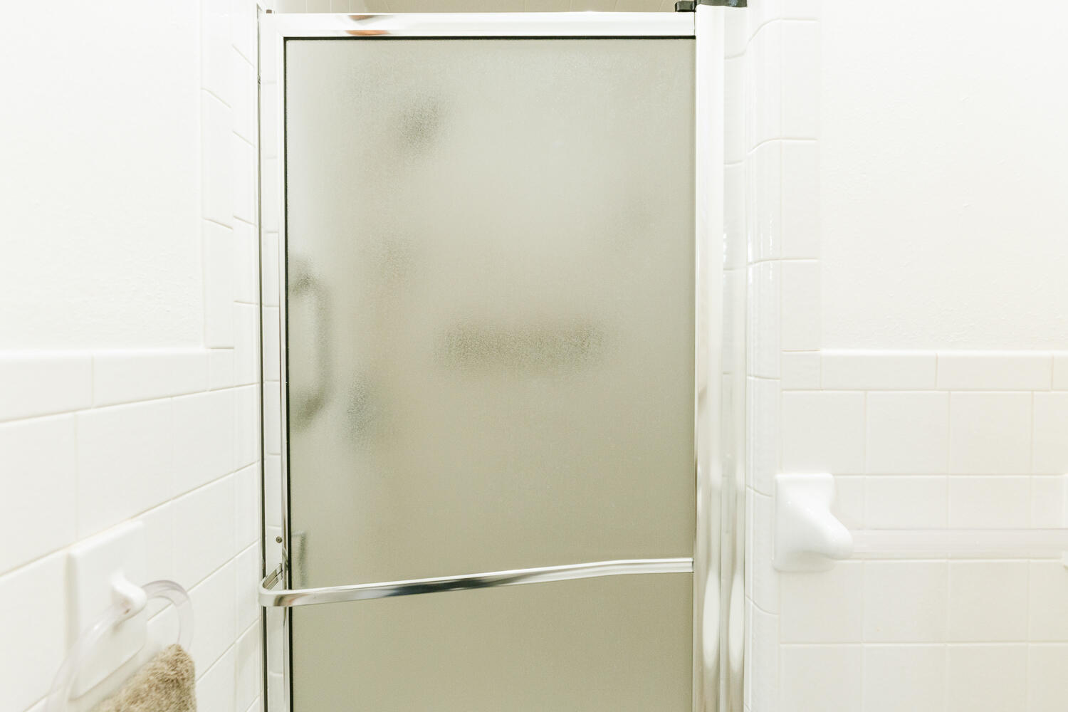 850 South 10th Street Slaton, TX 79364 - Photo 28 of 57 a bathroom with a glass shower door