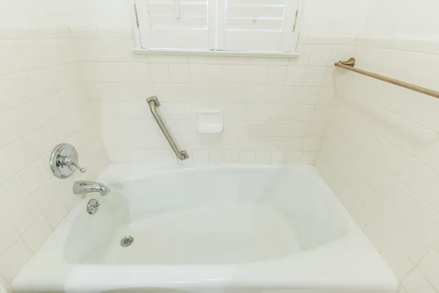 a bathroom with a shower and a sink