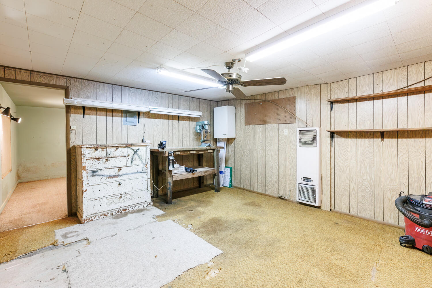 850 South 10th Street Slaton, TX 79364 - Photo 45 of 57 a view of a livingroom with furniture and a ceiling fan