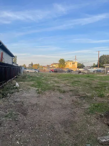 a view of a field with an ocean view