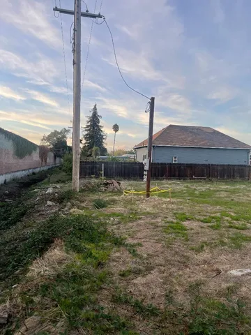 a small pool with lawn chairs in front of it